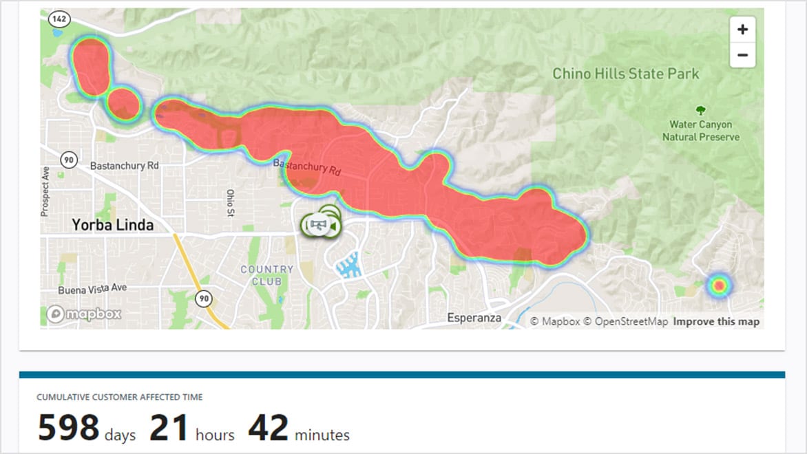 User interface showing topographical town map with outage area overlaid in color