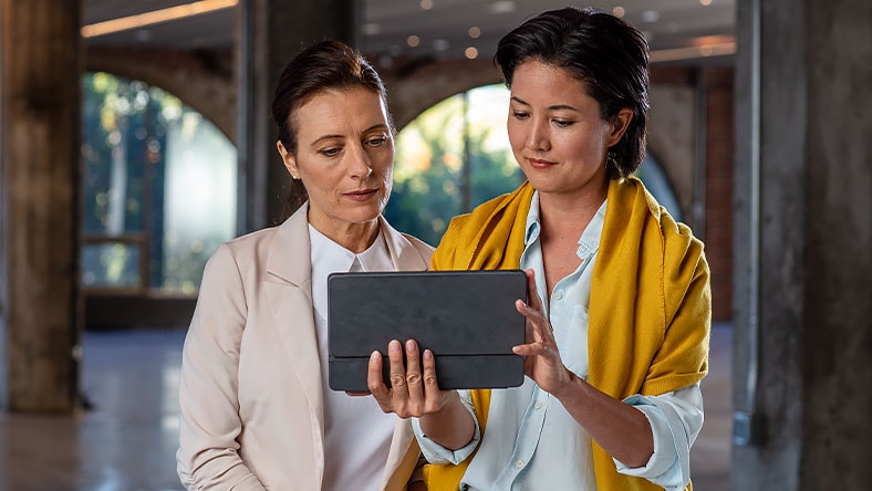 Two women using tablet