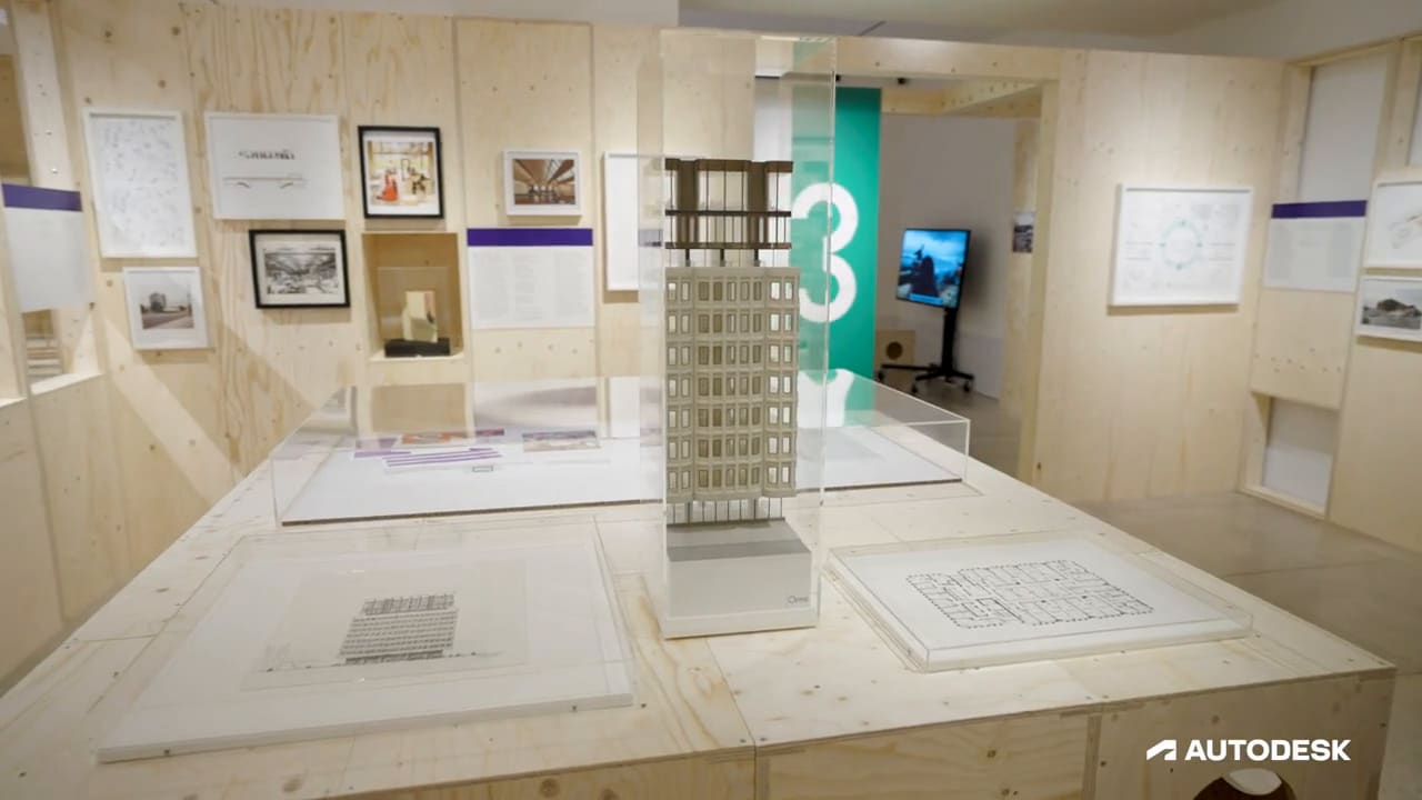 A model of a building sits in the center of the room
